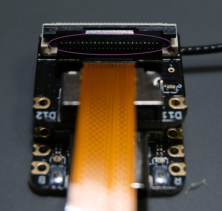 Line up the camera with the pins on the connector like below.