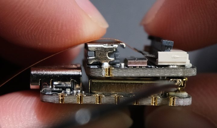 Now, close the camera connector by flipping the grey part down.