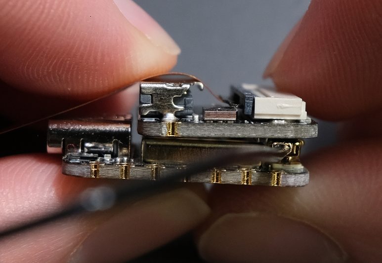 Now, close the camera connector by flipping the grey part down.