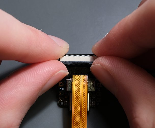 Be gentle so you do not damage the ribbon cable.