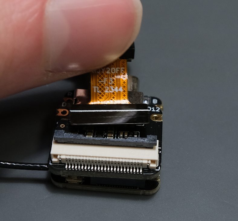 Now grab the camera and gently wiggle it out of the connector.